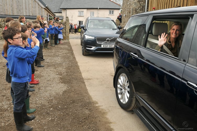 Photo: Steve Pope MDA030522A_SP002
TRH The Earl and Countess of Wessex visit East  Shallowford Farm on Dartmoor to open the Farm Development Project 2022. Youngsters from Widecombe Primary School wave goodbye to the Countess