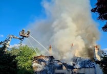 Teignbridge firefighters battling thatched property blaze
