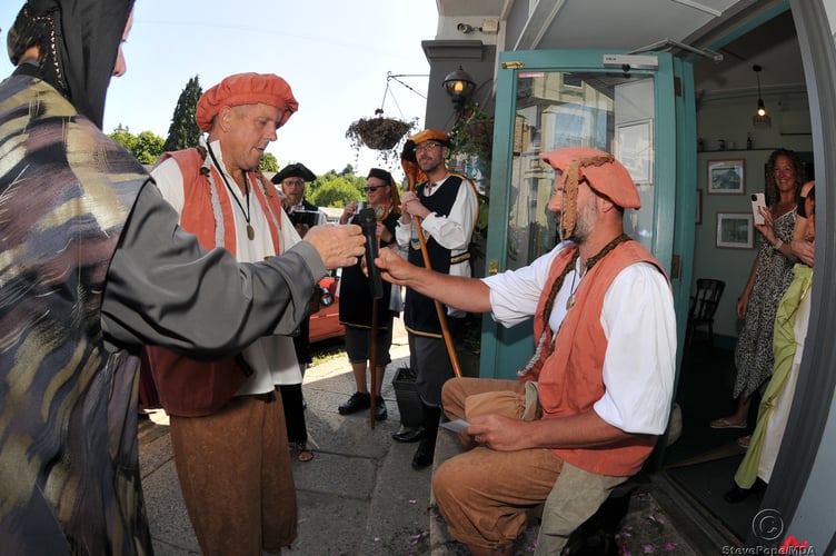Photo: Steve Pope MDA160722C_SP006
Ashburton Ale Tasting and Bread Weighing Ceremony. Ale tasters Nick Laity and Tony Lewis check the ale with the seated stool test.