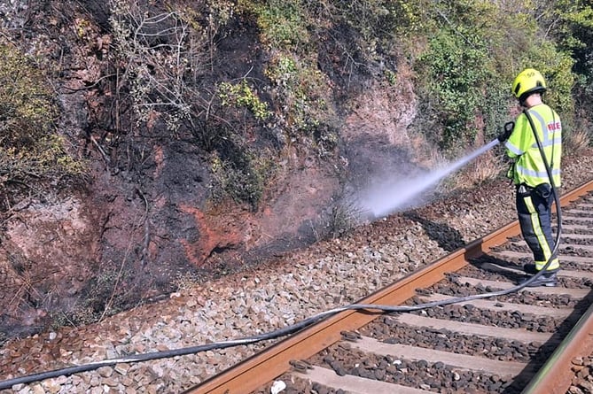 FIREfighters from Newton Abbot worked with Network Rail staff to put out flames on a rail embankment in Teignmouth Road. Trains were stopped for a while yesterday afternoon, Monday, while they dealt with the fire.
Picture: Newton Abbot Fire Station (Aug 29, 2022)