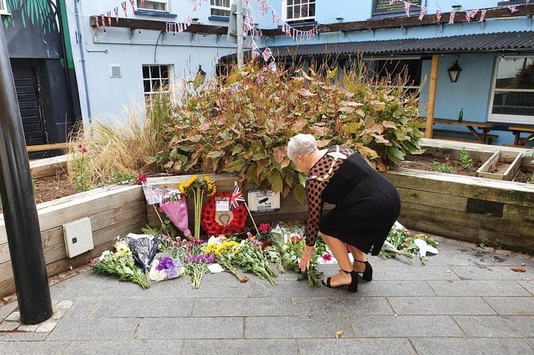 The Mayor of Newton Abbot, Councillor Carol Bunday, paying her respects to Her Majesty the Queen, on Golden Lion Square.
Picture: Newton Abbot Town Council (September 2022)