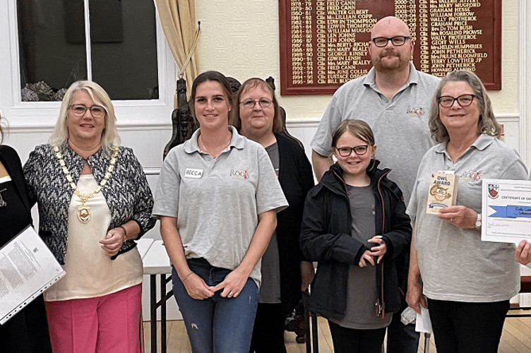 Cllr Carole Tamlyn, left, and mayor Cllr Lisa Mayne with representatives of Roots.