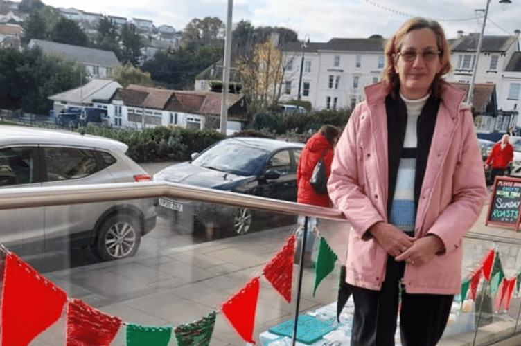 Noreen Goodchild pictured with some of her knitted bunting.
