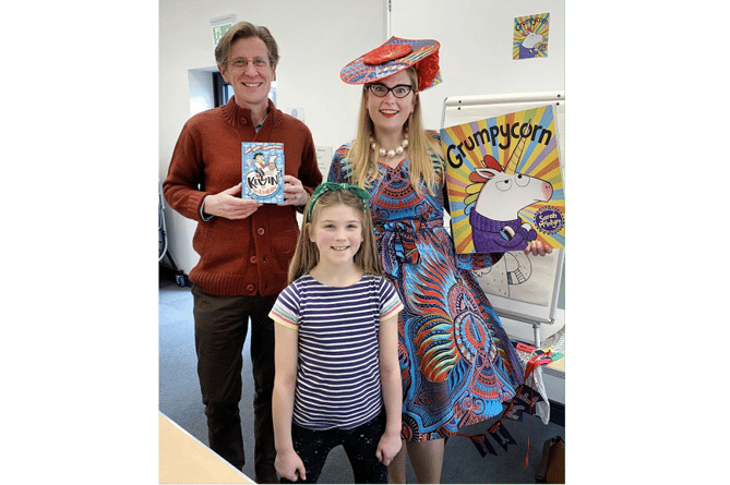 Local authors Sarah McIntyre and Philip Reeve, pictured with Bella Stephens, aged eight, at the Unicorn Party in Bovey Tracey Library