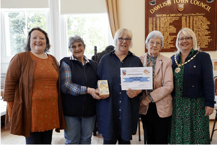 Dawlish Ladies Social Lunch Group representatives receive their Owl Award.