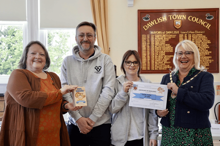 Dawlish Action for Youth representatives receive their Owl Award.