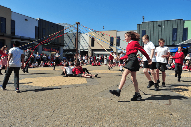 Lords and ladies of the dance  – pupils dance around the May Pole in Newton Abbot’s  Market Square.