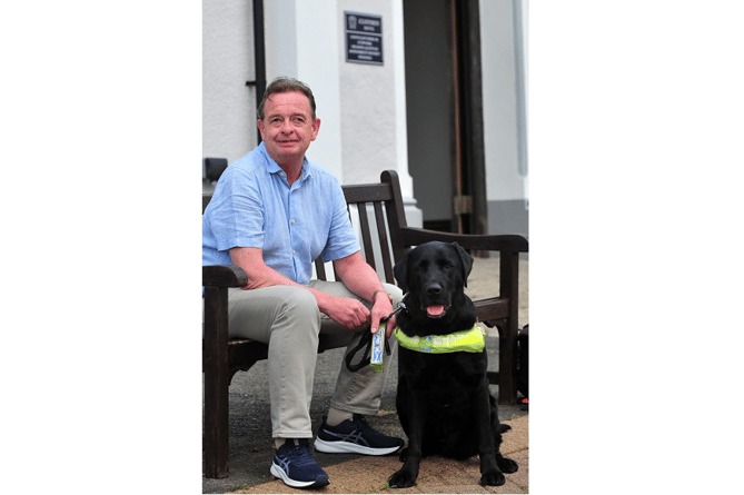 Jules Griffin and guide dog Adam at the Cliffden Hotel.