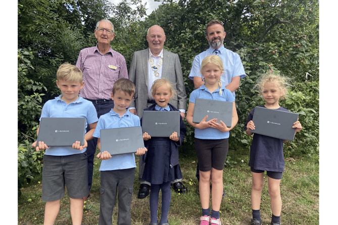 Children from Bishopsteignton Primary School with the new laptops from Dartmoor Vale Rotary Club.