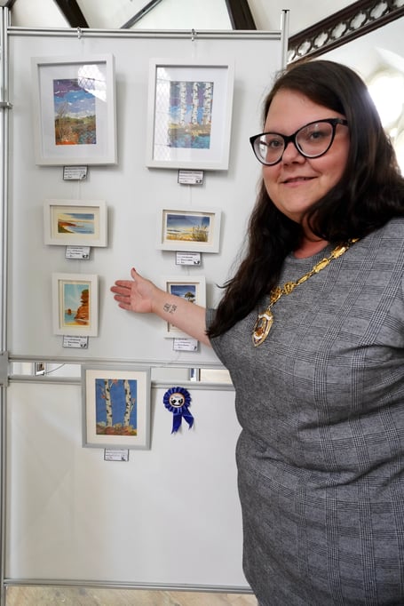                               Mayor of Dawlish Rosie Dawson with some of the work on show at the Strand Centre Dawlish 