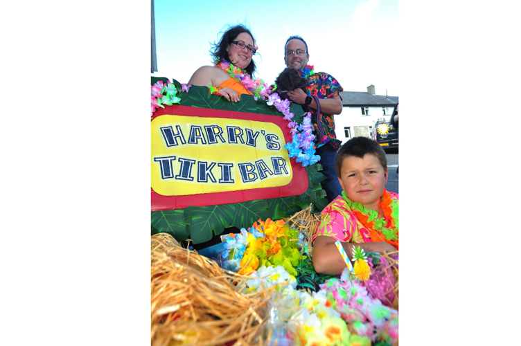 Harry’s Tiki Bar. Amy Ed and Harry Willis with Tinkerbelle the dog.