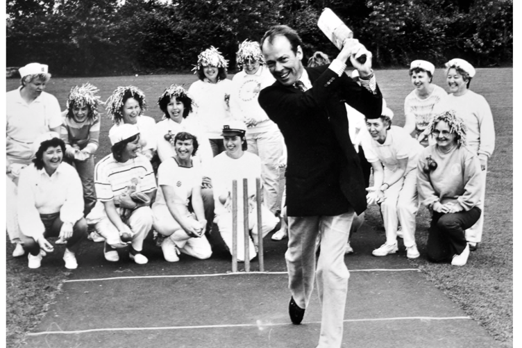 Lord Exmouth takes to the crease at Abbotskerswell’s cricket ground in July 1988 during a Torbay Sea Cadets fun day . The ladies teams, who played later, admire his Lordship’s batting prowess.