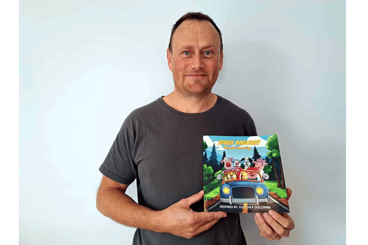 Tony Discombe with the book he has written in memory of his beloved son Fletcher