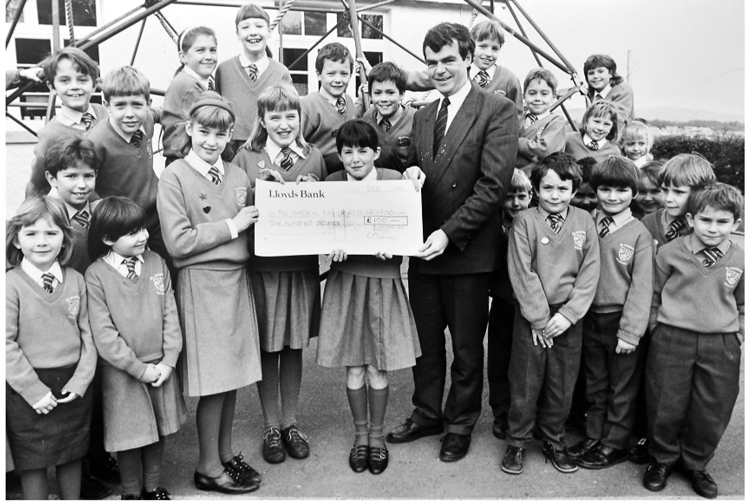 Pupils from Blackpool School present Pete Vincent , the regional appeals manager from the Imperial Cancer Reserach Fund, with a cheque for £100. The money was raised after pupils held a tea party at the school.