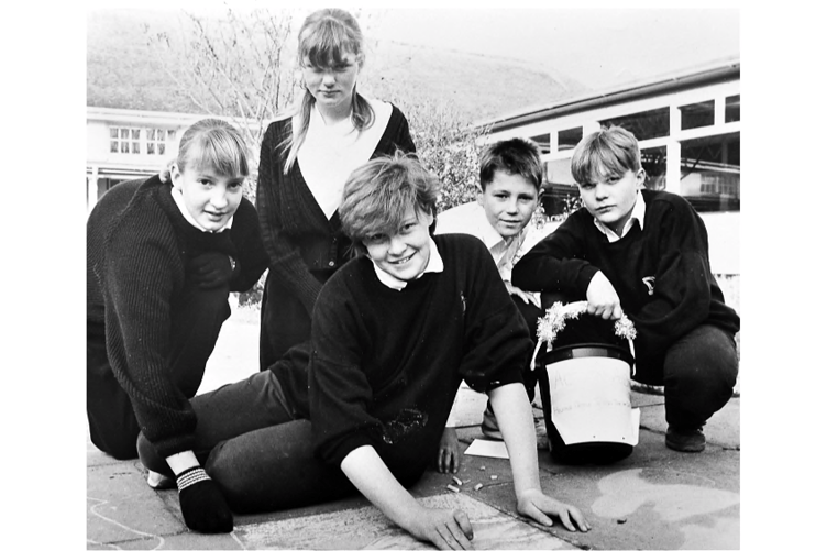 Pavement art for Action Aid from Dawlish School pupils Sally Wood, Hannah Turley, artist
Nicola Trebilcock, Ian Mahoney and Andy Hare in Decemeber 1990