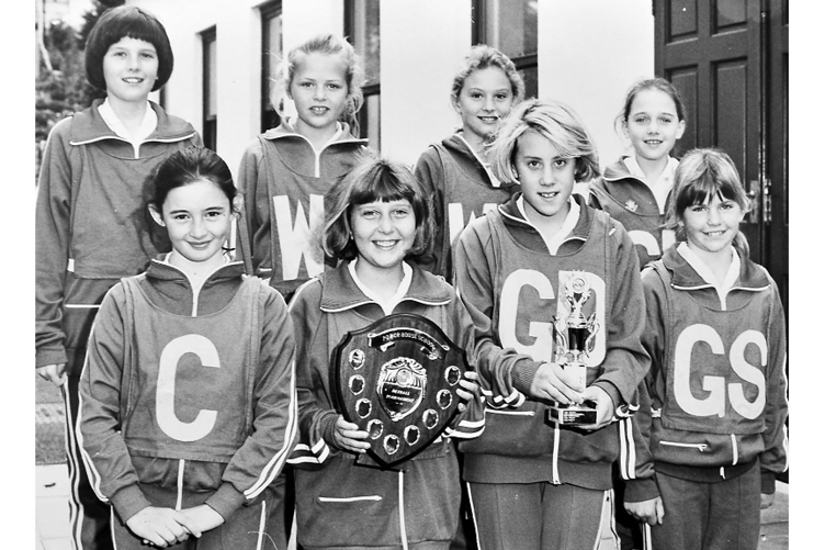Youngters from Teignmouth’s Trinity School’s netball team are looking very pleased with
their haul of trophies