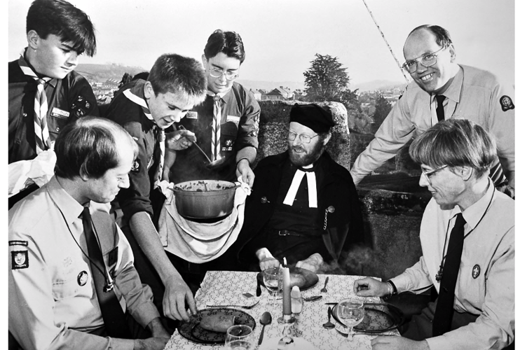 Rev’d John Leonard takes lunch on top of St Mary’s Church tower with 1st Kingskerswell Scouts