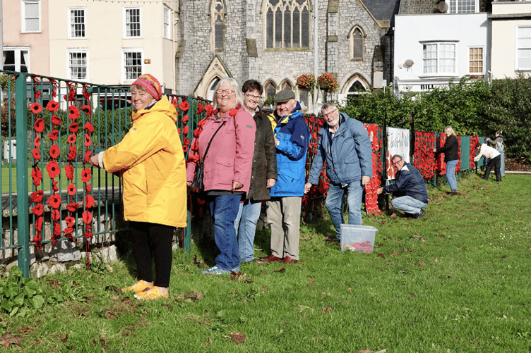 Assembling the poppy wall at Dawlish