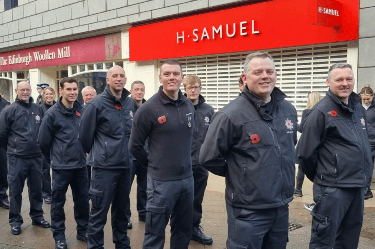 The crew of Newton Abbot Fire Station parading through the town to mark Remembrance Day