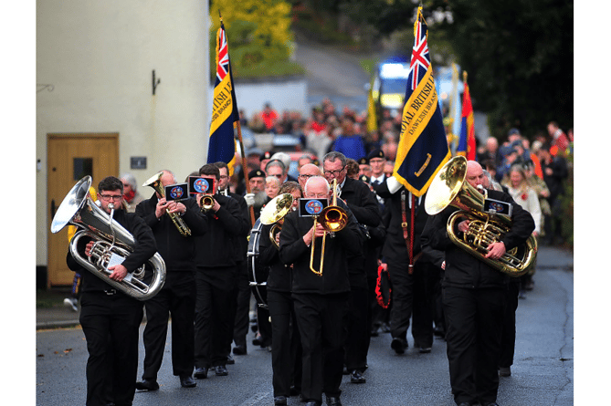 The Remembrance Day parade in Dawlish makes its way to St Gregory’s Church.