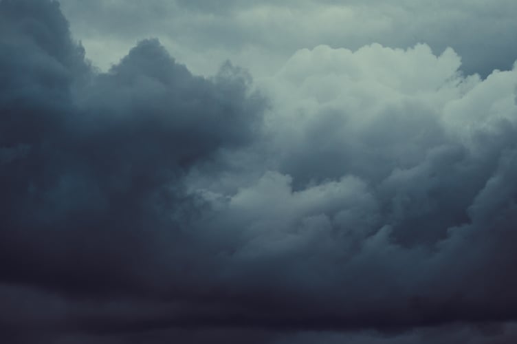 Storm sky with dark grey cumulus clouds.  Thunderstorm