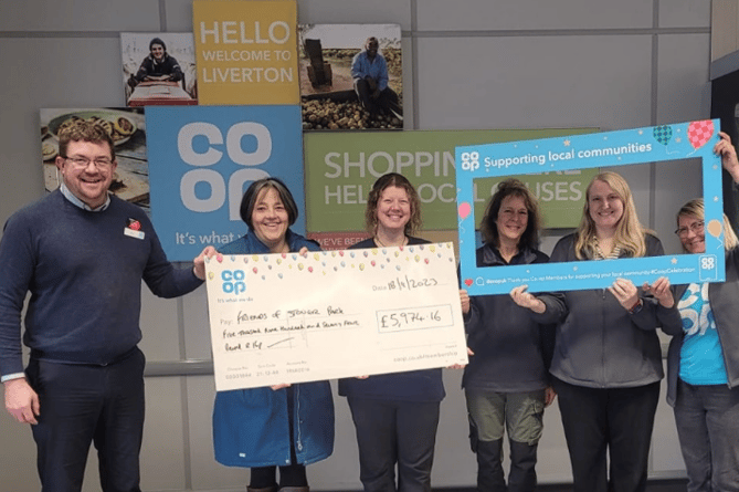 Friends of Stover Country Park being presented with a cheque for nearly £6,000 by Co-op Liverton