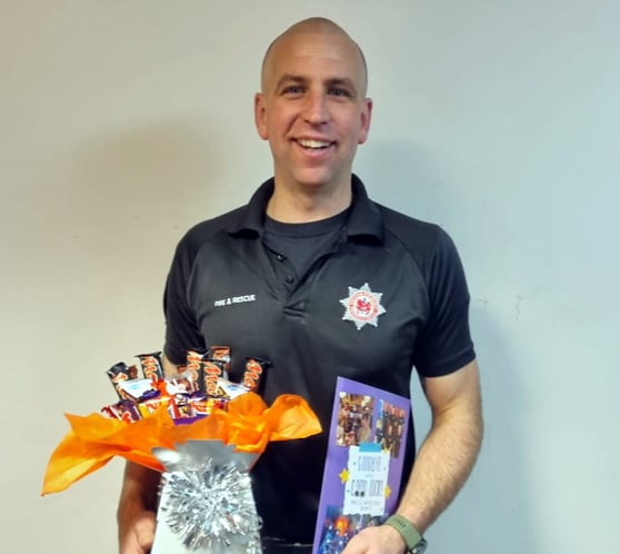 Firefighter Ben bows outfrom Newton Fire Station