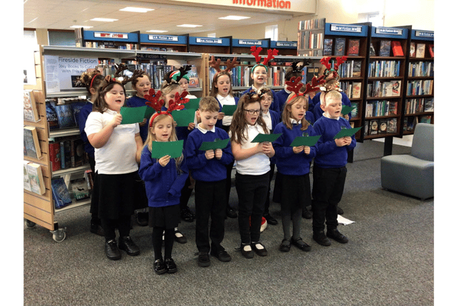 TPS choir performing at Teignmouth Library