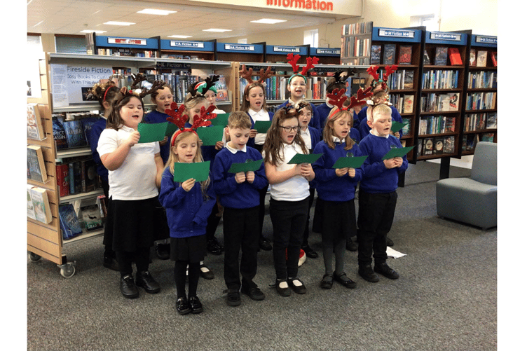 TPS choir performing at Teignmouth Library