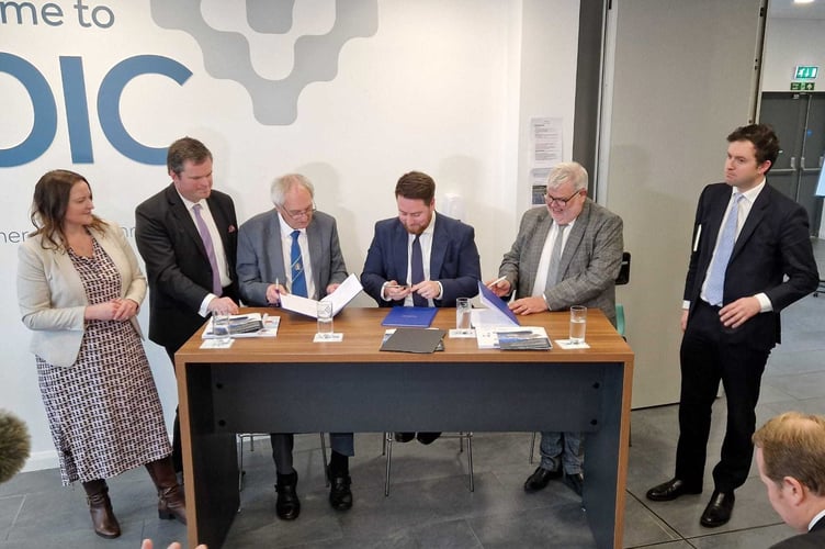 At the signing of the proposed Deal, from left: Alison Hernandez, Police and Crime Commissioner for Devon, Cornwall and the Isles of Scilly; Kevin Foster, MP for Torbay; Councillor John Hart, Leader of Devon County Council; Jacob Young, Levelling Up Minister; Councillor David Thomas, Leader of Torbay Council and Anthony Mangnall, MP for Totnes.