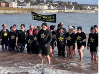 Singers brave the briney to raise a few hundred notes for Comic Relief