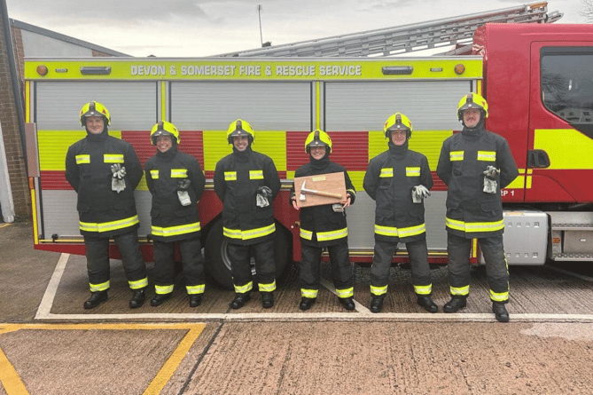 Smiles all around! Firefighters in Moretonhampstead celebrated the achievements of their recruits Oli and Joseph