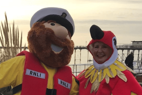 Anne, left, with Teignmouth RNLI's fundraising mascot, Stormy Stan.