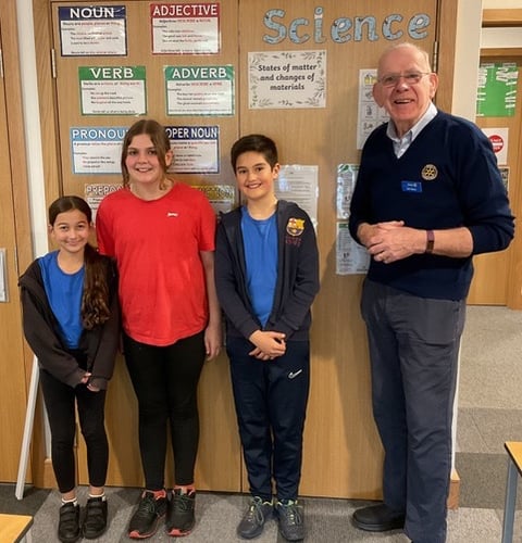 Rotarian Ray Moore with youngsters from the quiz competition