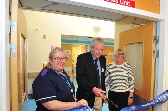 Official re-opening of the MIU at Dawlish Hospital. Cutting the ribbon from left: Sarah James, Jeff King and Jill King
