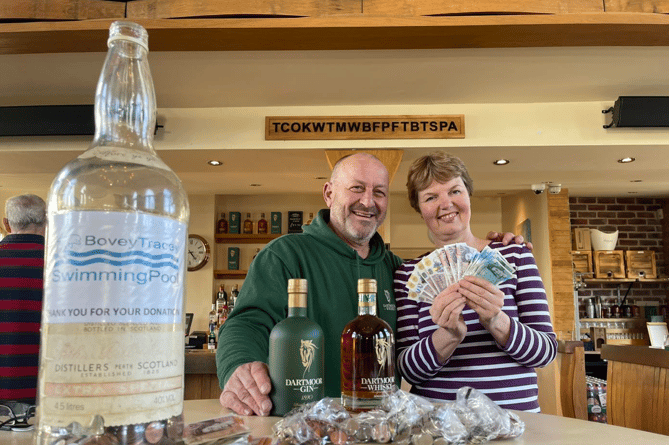 Dartmoor Whiskey Distillery's Greg Millar with Bovey Tracey Swimming Pool's secretary, Vanessa Steer.