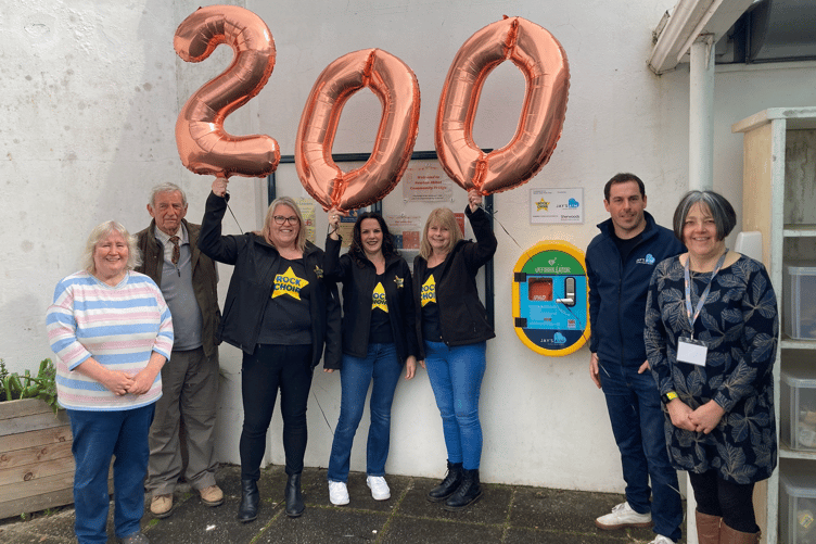 From left to right: The Courtenay Centre's Isobel Penny, John Addy, Chairman of the centre, Rock Choir members Helen Pring, Tracy Noonan and Julie Sanders, founder of Jay's Aim, Dan Osbourne and the Courtenay Centre's Emily Farrell.