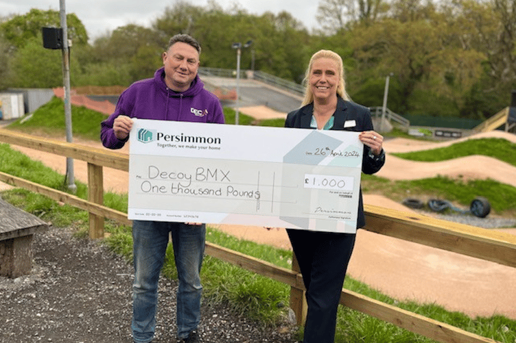 Chairman of Decoy BMX Club, Lee Kirby, with Persimmon Homes' Stacey Harris