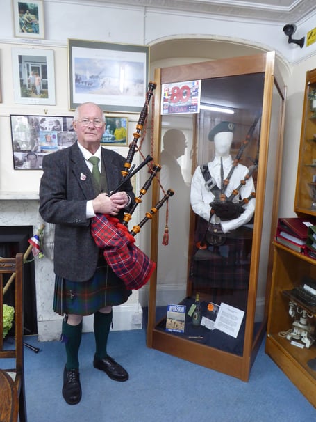 John Millin at Dawlish Museum with his father BNill's bagpipes 