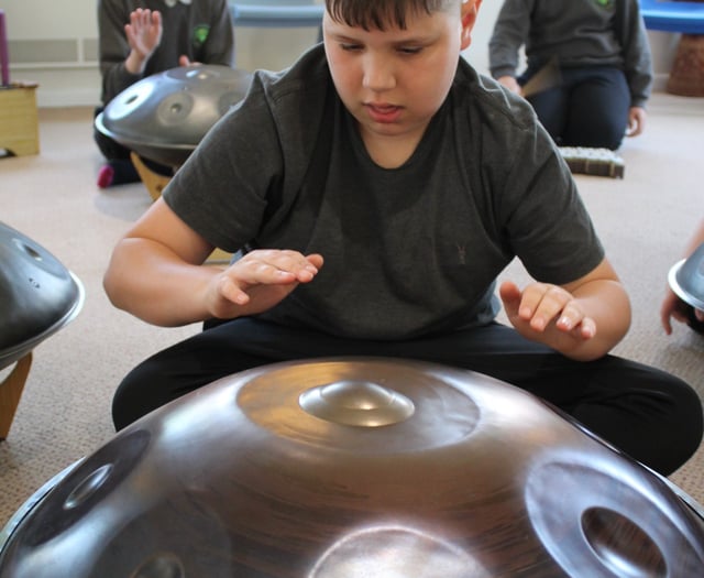 Children learn to bang the drum 