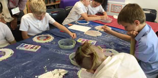 Children learn the art of silk painting 