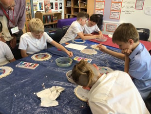 Children learn the art of silk painting 