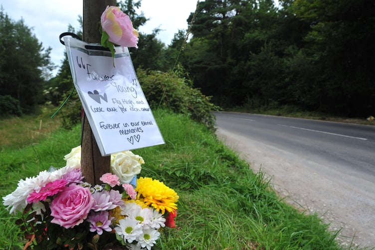 Floral tributes left at the site on the unclassfied road linking Haldon Hill and Telegraph Hill where two teenagers died following a single vehicle RTC on August 8