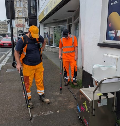 Task force clearing gum from pavements in Newton Abbot.
