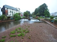 Volunteers wade in to clear waterway