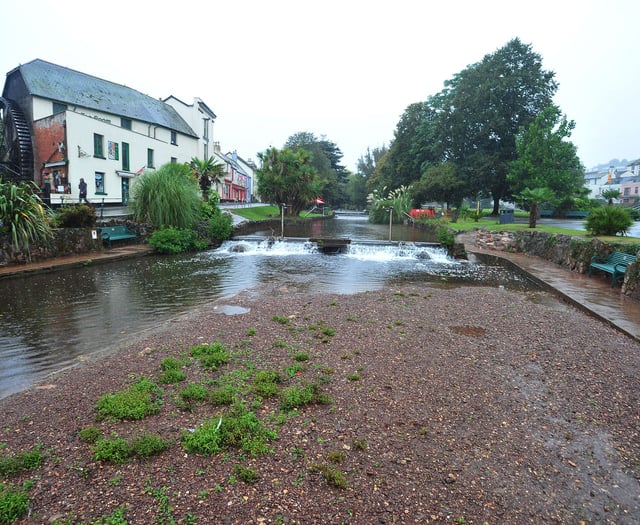Volunteers wade in to clear waterway
