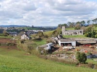 Road plans to controversial development narrowly approved 