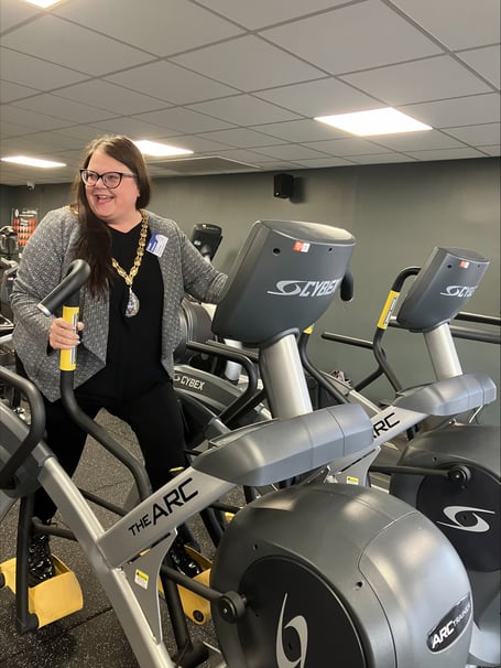 Teignbridge Council chairman Cllr Rosie Dawson tries out new accessible gym equipment.