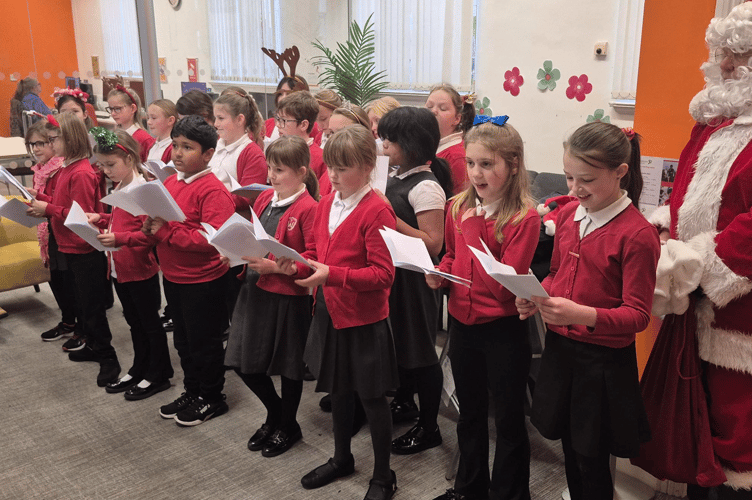 Pupils from Wolborough Primary School recently sung Christmas carols at Newton Abbot Library