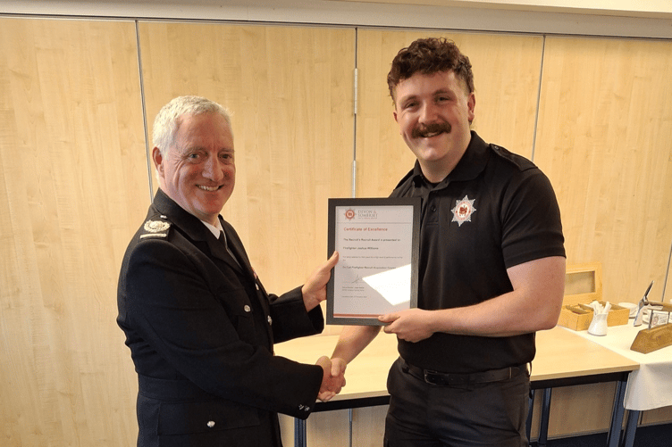 Area Manager Wayne Rawlins presenting Joshua Williams from Ashburton Fire Station his Recruits Award
